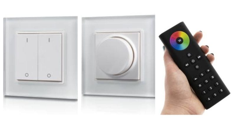 LED-valojen kaukosäädin värikkäällä kosketuslevyllä ja painikkeilla, asennetun valkoisen himmentimen vieressä; parantaa kodin älykkään valaistuksen ohjausta.