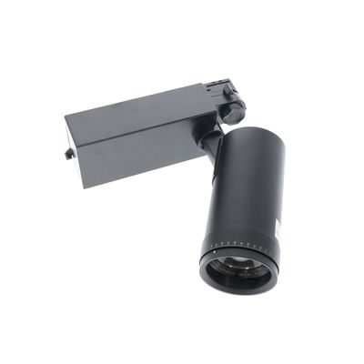 Moderne schwarze Schienenleuchte mit einer zylindrischen Lampe auf einem rechteckigen Sockel, schräg vor einem weißen Hintergrund für eine stilvolle Beleuchtungslösung.