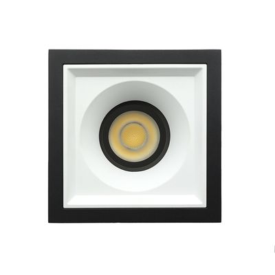 Rechteckige Deckeneinbauleuchte mit schwarzem Rahmen und zentraler runder LED-Lampe für moderne Beleuchtungslösungen.