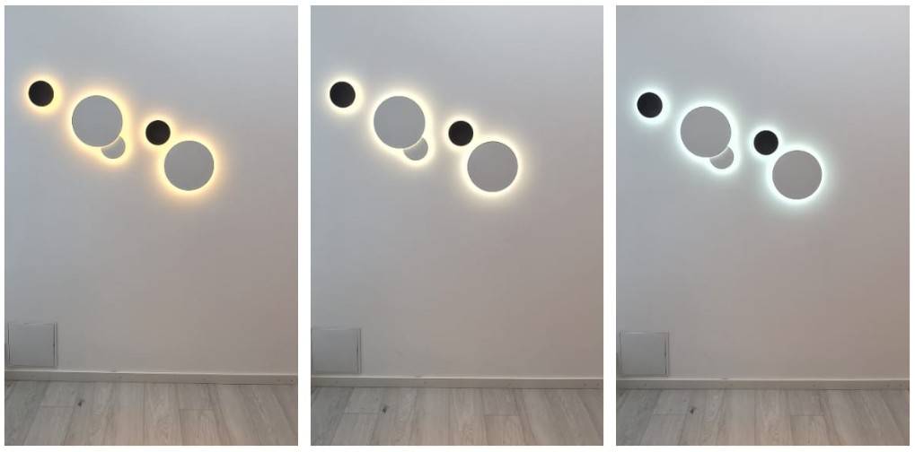 Runde Eclipse-Wandleuchten, gruppiert in einer Serie von fünf Leuchten.
